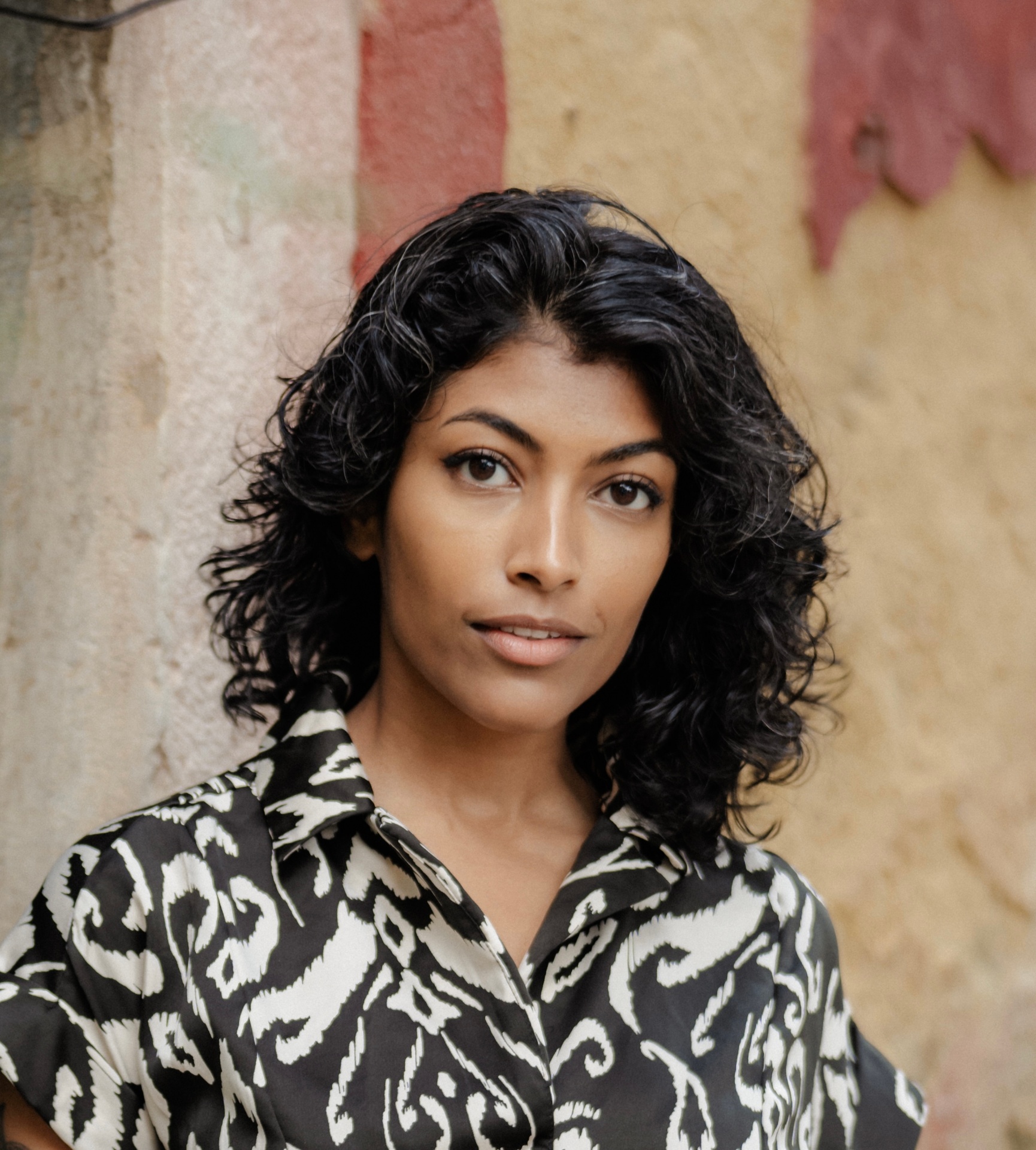 A woman at ease, looking quietly confident